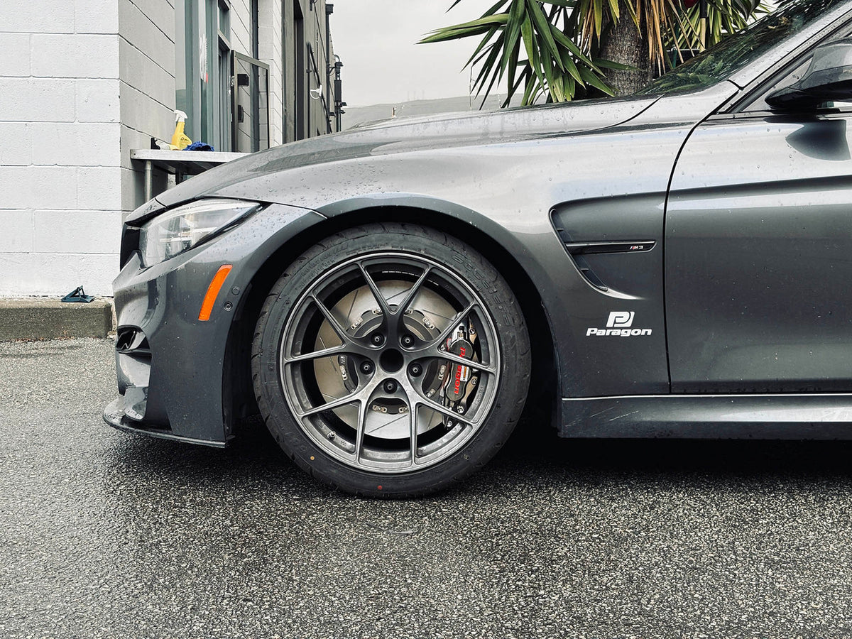 Paragon front brake kit visible behind the wheel on a gray BMW F80 M3